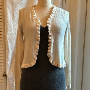 CASHMERE CREAM SWEATER, Neiman Marcus. Ruffled details. One button closure XS-S